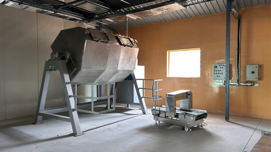 Industrial stainless steel ribbon mixer for uniform blending of organic herbal powders at Herb Artizan